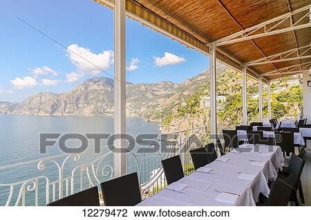 A million dollar view from the restaurant balcony at a coastal resort on the Mediterranean Sea along the tourist drive of the Amalfi Coast in Italy; Amalfi, Province of Salerno, Italy View Large Photo Image Stock Image - A million dollar view from the restaurant balcony at a coastal resort on the Mediterranean Sea along the tourist drive of the Amalfi Coast in Italy; Amalfi, Province of Salerno, Italy. Fotosearch