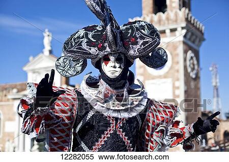 Stock Photography - A person in an ornate costume and mask; Venice, Italy. Fotosearch