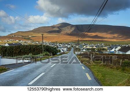 Stock Photograph - A road leading into Dooagh village on Achill island, Wild Atlantic Way; Achill Island, County Mayo, Ireland. Fotosearch