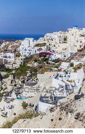 Stock Image - A view of the village of Oia; Oia, Santorini, Cyclades, Greece. Fotosearch