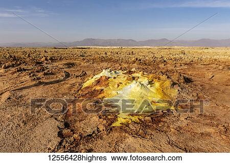 Stock Photograph - Acidic hot springs and geysers, mineral formations, salt deposits in the crater of Dallol Volcano, Danakil Depression; Afar Region, Ethiopia. Fotosearch