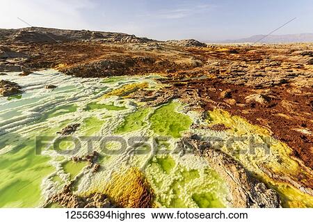 Stock Photograph - Acidic pools, mineral formations, salt deposits in the crater of Dallol Volcano, Danakil Depression; Afar Region, Ethiopia. Fotosearch