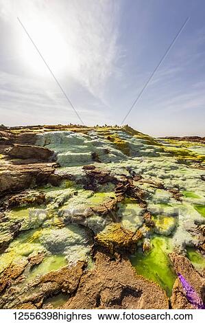 Stock Photograph - Acidic pools, mineral formations, salt deposits in the crater of Dallol Volcano, Danakil Depression; Afar Region, Ethiopia. Fotosearch