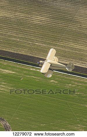 Stock Image - Aerial view of PR 1937 Cabin Waco BiPlane, near Mount Vernon; Washington, United States of America. Fotosearch