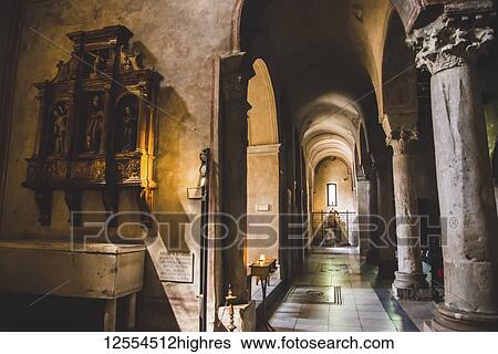 Stock Photograph - Artwork and windows in cathedral; Italy. Fotosearch