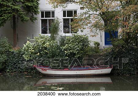 Stock Image - Boat Named 'rosa' Moored Outside A House Along Matthijs Tinxgracht, Edam, Netherlands.. Fotosearch