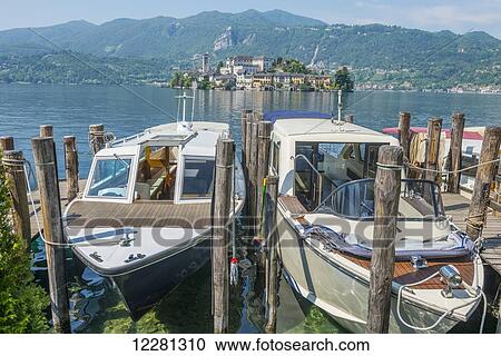 Boats moored in a harbour on Lake Orta; Orta, Piedmont, Italy View Large Photo Image Stock Image - Boats moored in a harbour on Lake Orta; Orta, Piedmont, Italy. Fotosearch