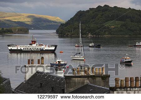 Stock Photo - Boats moored in the tranquil harbour; Isle of Mull, Argyll and Bute, Scotland. Fotosearch