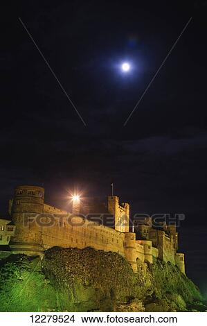 Picture - Bright moonlight over Bamburgh Castle; Bamburgh, Northumberland, England. Fotosearch