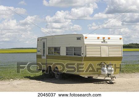 Camper Trailer Parked At Side Of Alfalfa And Canola Field Near Winnipeg, Manitoba, Canada View Large Photo Image Stock Photo - Camper Trailer Parked At Side Of Alfalfa And Canola Field Near Winnipeg, Manitoba, Canada. Fotosearch