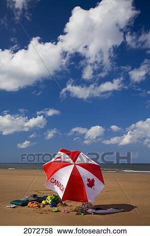 Canada Beach Umbrella, North Rustico, Prince Edward Island View Large Photo Image Stock Photo - Canada Beach Umbrella, North Rustico, Prince Edward Island. Fotosearch