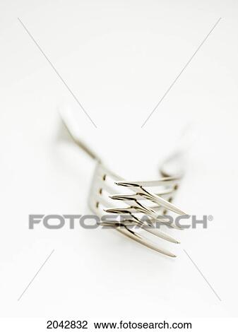 Stock Image - Close Up Of Two Forks On A White Background. Fotosearch