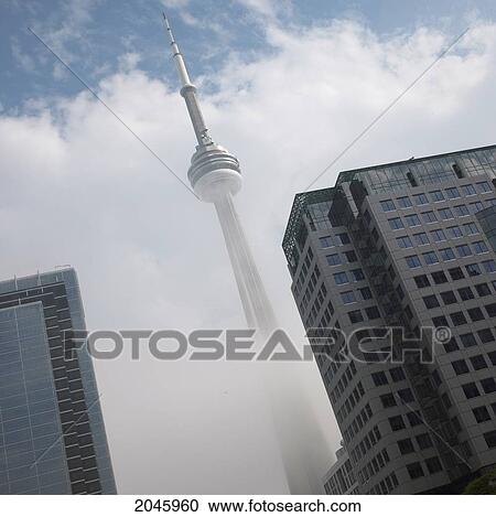 Stock Image - Cn Tower In Fog, Toronto, Ontario. Fotosearch