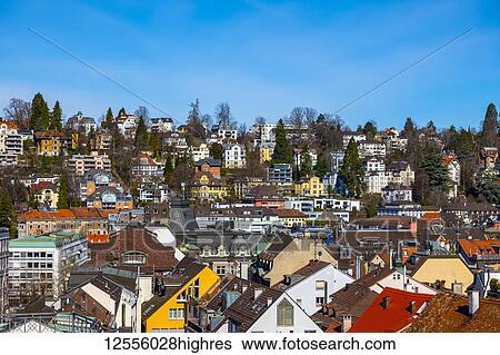 Stock Photograph - Colourful cityscape with houses, residential buildings and rooftops; St. Gallen, St. Gallen, Switzerland. Fotosearch