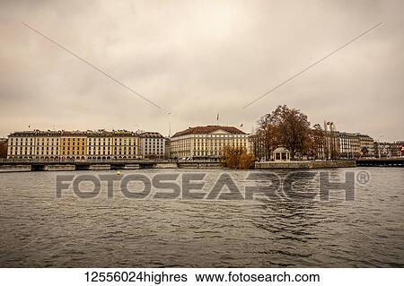 Stock Photograph - Colourful residential buildings along the water of Lake Geneva; Geneva, Geneva, Switzerland. Fotosearch
