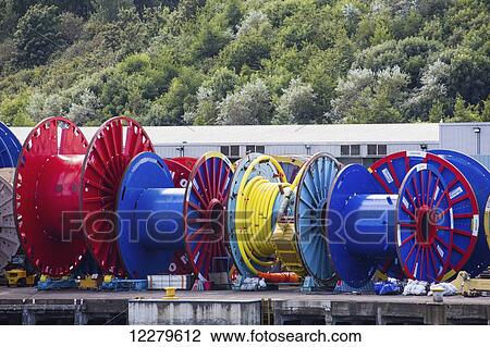 Stock Image - Colourful spools on a dock; Wallsend, Tyne and Wear, England. Fotosearch