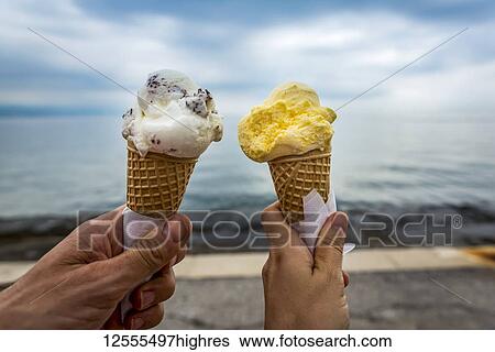 Stock Photograph - Couple with ice cream cones; Opatija, Primorje-Gorski Kotar County, Croatia. Fotosearch