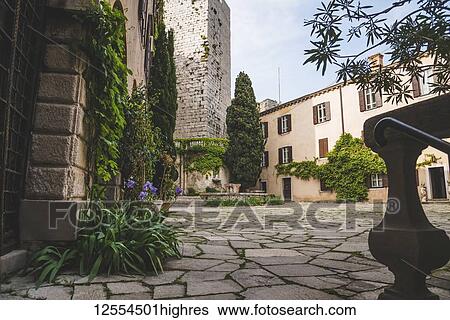 Stock Photograph - Courtyard of Duino Castle; Italy. Fotosearch
