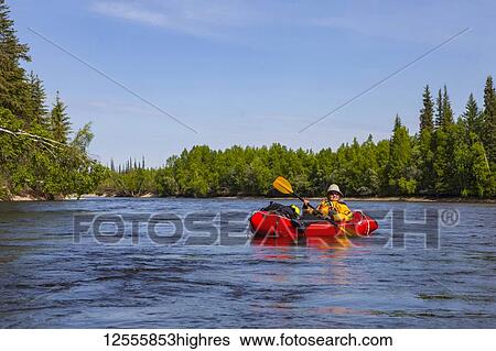 Female packrafter relaxing on a mellow stretch of the Charley River, YukonCharley Rivers National Preserve; Alaska, United States of America View Large Photo Image Stock Photograph - Female packrafter relaxing on a mellow stretch of the Charley River, YukonCharley Rivers National Preserve; Alaska, United States of America. Fotosearch