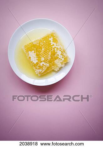 Fresh Honey Comb On A White Plate With A Pink Background View Large Photo Image Stock Photo - Fresh Honey Comb On A White Plate With A Pink Background. Fotosearch