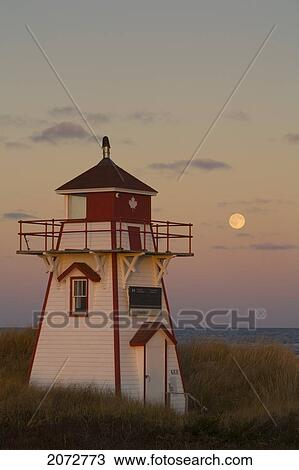Stock Image - Full Moon Over Covehead Lighthouse, Prince Edward Island National Park, Prince Edward Island. Fotosearch