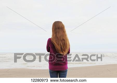 Girl standing on beach; Toronto, Ontario, Canada View Large Photo Image Stock Image - Girl standing on beach; Toronto, Ontario, Canada. Fotosearch