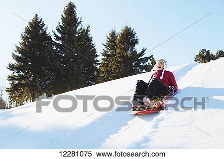 Girl tobogganing; King City, Ontario, Canada View Large Photo Image Stock Photography - Girl tobogganing; King City, Ontario, Canada. Fotosearch