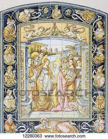 Stock Image - Glazed tile altarpiece of The Visitation in the Alcazar of Seville, Spain, created in 1503 by the Pisan artist Francesco or Francisco Niculoso,? - 1529, (aka Niculoso Pisano). From Enciclopedia Ilustrada Seguí, published Barcelona circa 1910.. Fotosearch