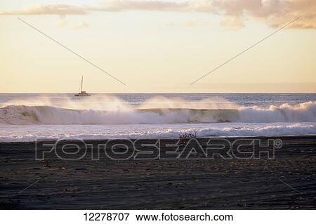Golden surf visible from Barking Sands Beach with catamaran crossing the channel; Kekaha, Kauai, Hawaii, United States of America View Large Photo Image Stock Photo - Golden surf visible from Barking Sands Beach with catamaran crossing the channel; Kekaha, Kauai, Hawaii, United States of America. Fotosearch