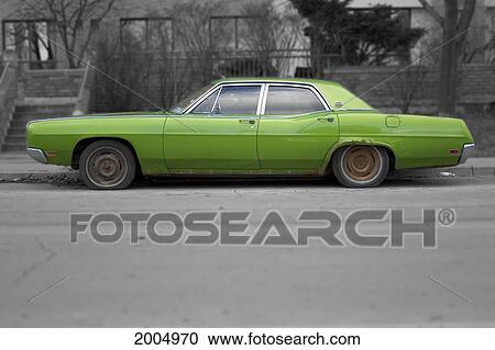 Stock Image - Green Car On Street. Fotosearch