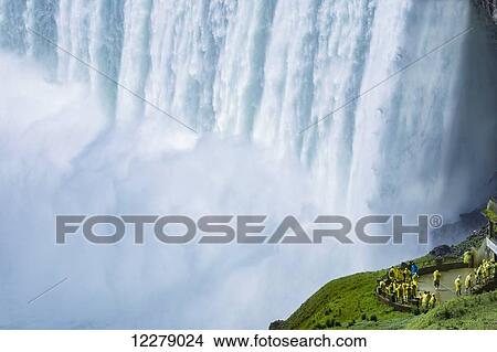 Group of tourists by Niagara Falls waterfall; Niagara Falls, Ontario, Canada View Large Photo Image Picture - Group of tourists by Niagara Falls waterfall; Niagara Falls, Ontario, Canada. Fotosearch