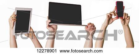 Hands holding tablet, laptop and cell phone in the air above their heads on white background; Sherwood Park, Alberta, Canada View Large Photo Image Stock Image - Hands holding tablet, laptop and cell phone in the air above their heads on white background; Sherwood Park, Alberta, Canada. Fotosearch