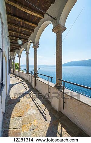 Hermitage of Santa Caterina del Sasso, a roman catholic monastery; Leggiuno, Lombardy, Italy View Large Photo Image Picture - Hermitage of Santa Caterina del Sasso, a roman catholic monastery; Leggiuno, Lombardy, Italy. Fotosearch