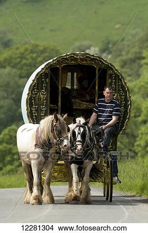 Horse drawn caravans heading towards the horse fair at Appleby in Westmorland; Cumbria, England View Large Photo Image Picture - Horse drawn caravans heading towards the horse fair at Appleby in Westmorland; Cumbria, England. Fotosearch