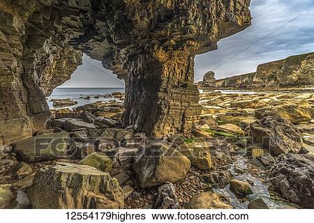 Inside Marsden Rock, a 100 feet (30 metre) sea stack off the North East coast of England, situated at Marsden, South Shields; South Shields, Tyne and Wear, England View Large Photo Image Stock Photograph - Inside Marsden Rock, a 100 feet (30 metre) sea stack off the North East coast of England, situated at Marsden, South Shields; South Shields, Tyne and Wear, England. Fotosearch