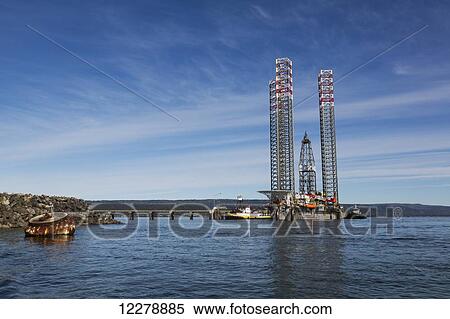 Stock Photography - Jack-up mobile drilling rig moored at a pier in Homer, Southcentral Alaska. Fotosearch