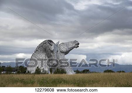 Kelpies under a cloudy sky; Falkirk, Scotland View Large Photo Image Stock Photo - Kelpies under a cloudy sky; Falkirk, Scotland. Fotosearch