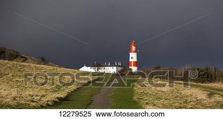 Lighthouse at the end of a path with storm clouds; South Shields, Tyne and Wear, England View Large Photo Image Stock Photography - Lighthouse at the end of a path with storm clouds; South Shields, Tyne and Wear, England. Fotosearch