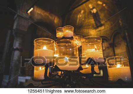 Lit candles and artwork in a cathedral; Italy View Large Photo Image Stock Photograph - Lit candles and artwork in a cathedral; Italy. Fotosearch