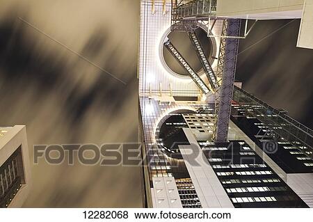 Stock Photo - Low angle view of a sky tower; Osaka, Japan. Fotosearch