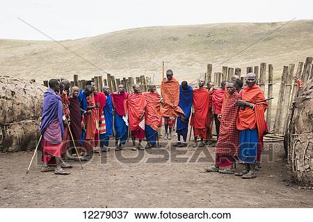 Maasai warriors wearing brightly coloured clothing ready to perform traditional dance, Ngorongoro Conservation Area; Tanzania View Large Photo Image Stock Photo - Maasai warriors wearing brightly coloured clothing ready to perform traditional dance, Ngorongoro Conservation Area; Tanzania. Fotosearch