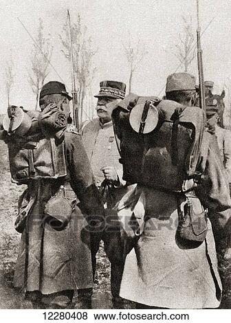 Stock Photo - Marshal Joseph Jacques Césaire Joffre, 1852 – 1931. French general during World War I. Seen here inspecting his troops. From The Illustrated War News, published 1915.. Fotosearch