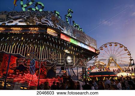 Stock Image - Midway With Ferris Wheel, Canadian National Exhibition, Toronto, Ontario. Fotosearch