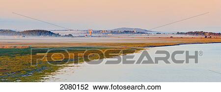 Mist Over The Fields And Village At Sunrise In Bas-Saint-Laurent Region; Kamouraska, Quebec, Canada View Large Photo Image Stock Image - Mist Over The Fields And Village At Sunrise In Bas-Saint-Laurent Region; Kamouraska, Quebec, Canada. Fotosearch