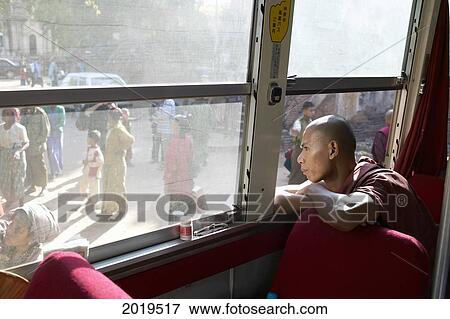 Stock Photo - Monk Looking Out A Bus Window, Bagan, Myanmar (Burma). Fotosearch