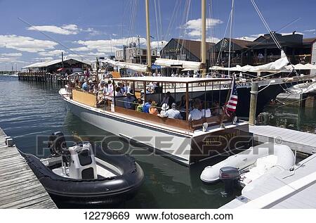 Stock Photo - M/V Rumrunner II 1929 classic motor yacht getting ready to take passengers on a harbour cruise; Newport, Rhode Island, United States of America. Fotosearch