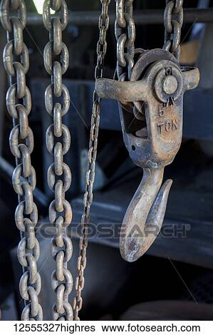 Stock Photograph - Old relics of gold mining equipment inside the Coal Creek Dredge; Coal Creek, Alaska, United States of America. Fotosearch
