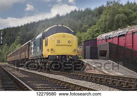 Passenger train stopped at a station; Ainthorpe, North Yorkshire, England View Large Photo Image Stock Image - Passenger train stopped at a station; Ainthorpe, North Yorkshire, England. Fotosearch