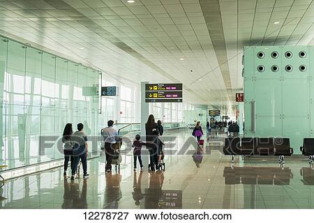Passengers in the Barcelona Airport; Barcelona, Spain View Large Photo Image Stock Photo - Passengers in the Barcelona Airport; Barcelona, Spain. Fotosearch