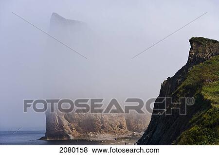 Stock Photo - Perce Rock In The Fog In The Gaspesie Region; Perce, Quebec, Canada. Fotosearch